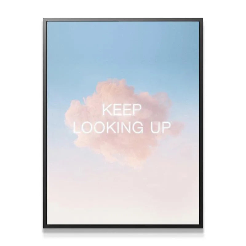 Detailed close-up of the ethereal white text displaying Keep Looking Up over a pink cumulus cloud.