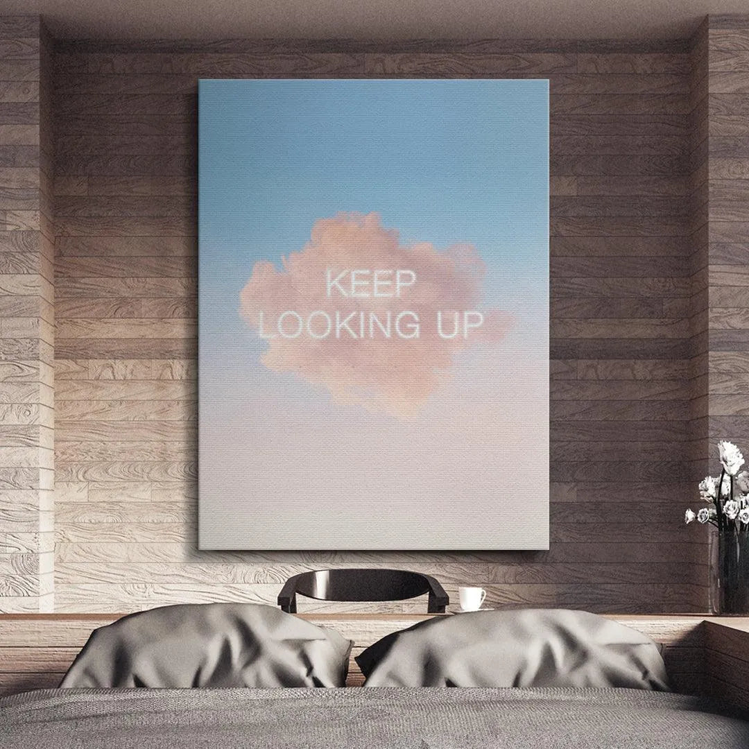 Modern office desk setting featuring the framed poster Keep Looking Up as inspirational wall decor.
