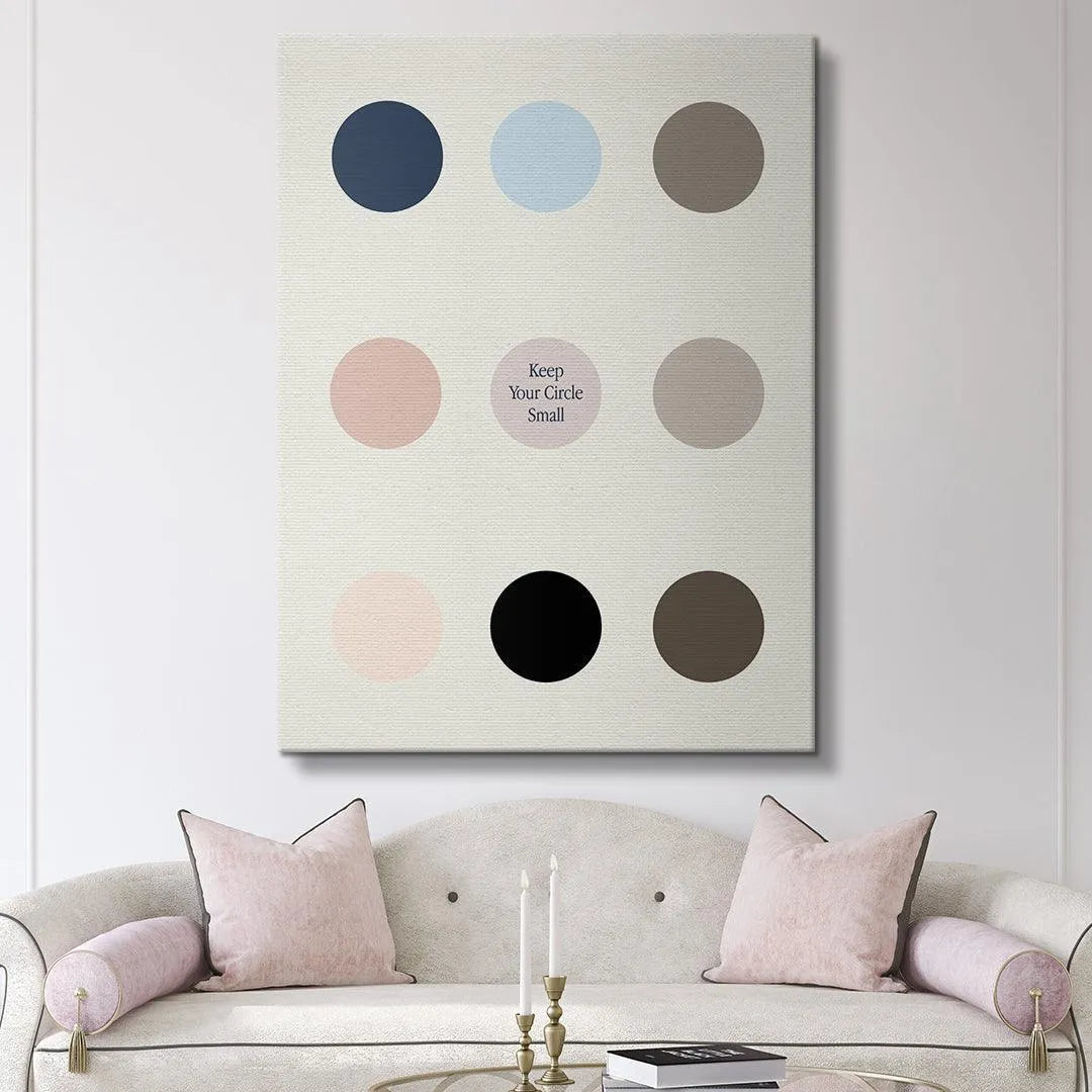 Art print showing Keep Your Circle Small displayed above a modern, minimalist desk setup.
