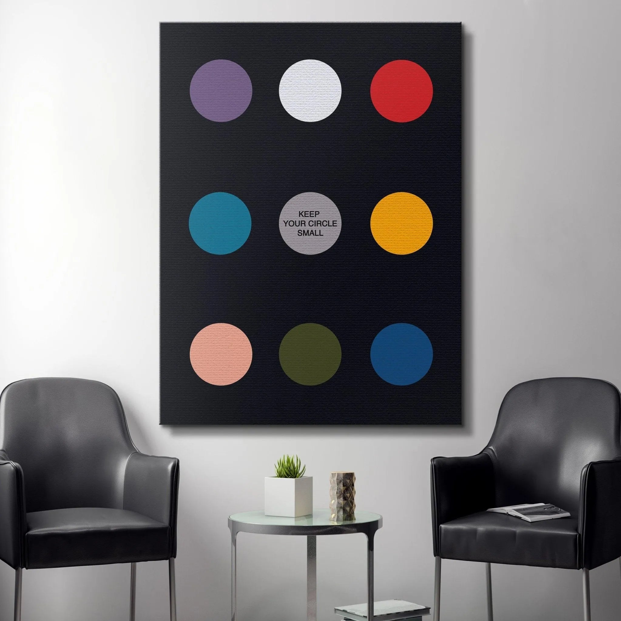 The conceptual art piece, Keep Your Circle Small Black Edition, viewed from a slight diagonal angle, showcasing edge definition.
