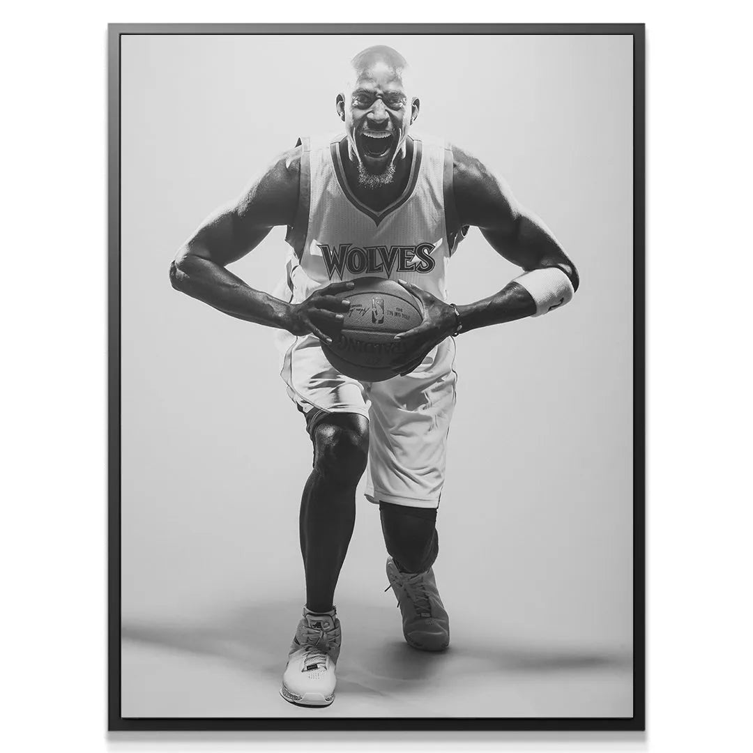 Close-up portrait of the intense facial expression of Kevin Garnett - #1, showing his determination mid-game.