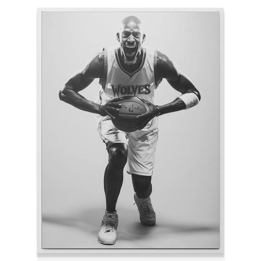 Mid-angle view of Kevin Garnett - #1 wearing his Timberwolves jersey and white wristband, ready to drive.