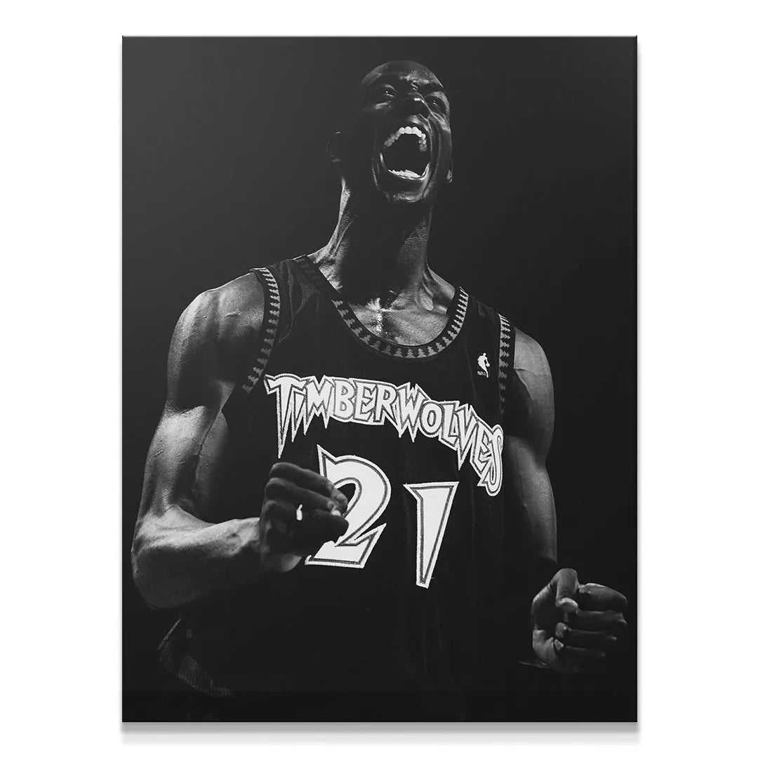 Close-up portrait of Kevin Garnett - #3 roaring mid-game, showcasing facial emotion.