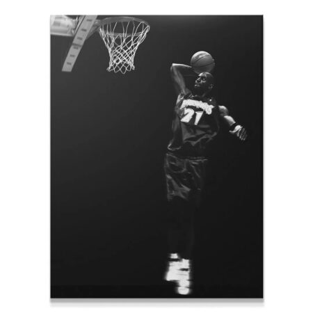 Iconic action shot of Kevin Garnett - #4 mid-air dunking the basketball against a dark studio background.