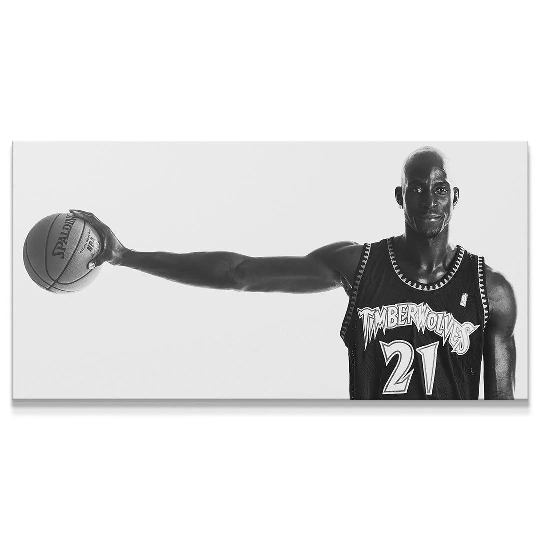 Full body portrait of Kevin Garnett - #5 holding a basketball, black and white studio shot.