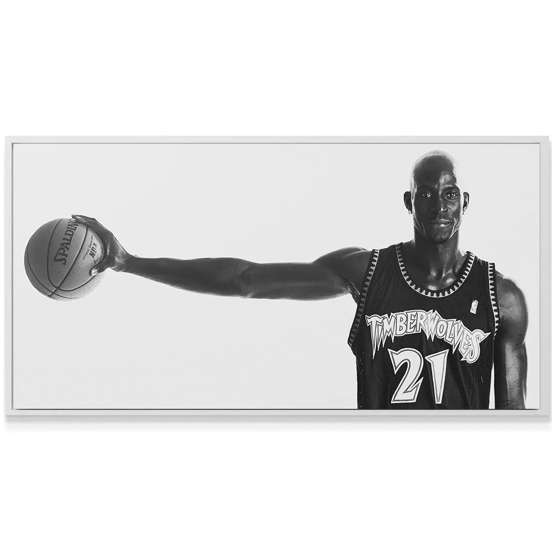 Texture of the Spalding basketball held by the extended arm of Kevin Garnett - #5.
