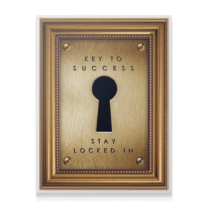 Angled view of the ornate golden frame surrounding the brass-look 'Key To Success' plaque art.