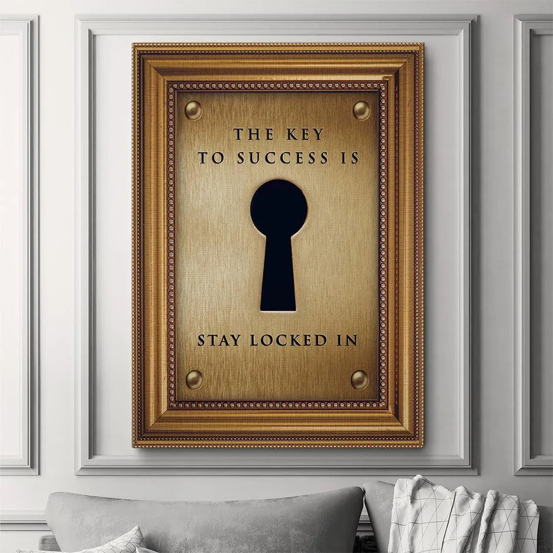 High-contrast photo focusing on the black keyhole silhouette on the polished 'Key To Success' print.