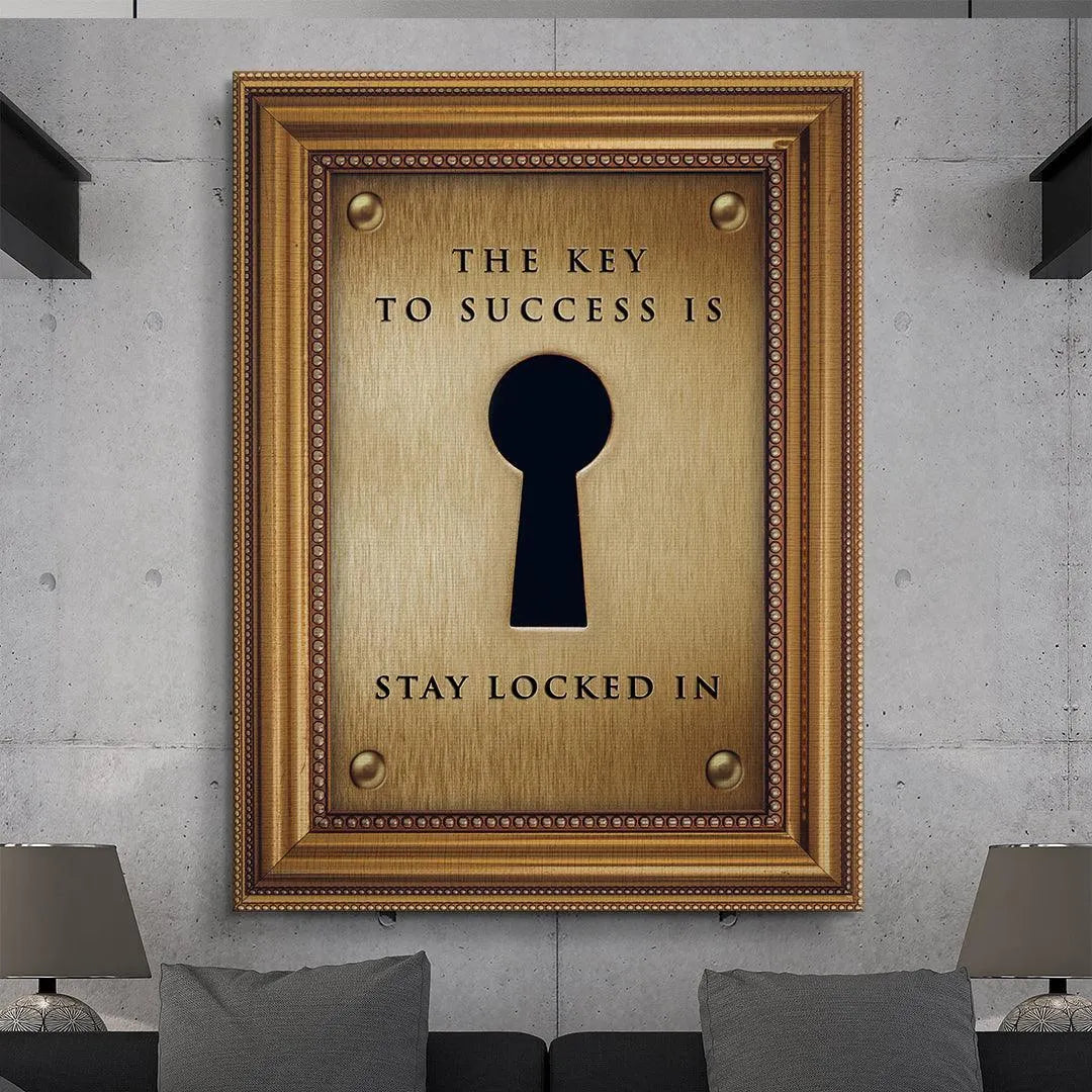 Lifestyle image showing the 'Key To Success' wall art hanging above a minimalist office desk setup.