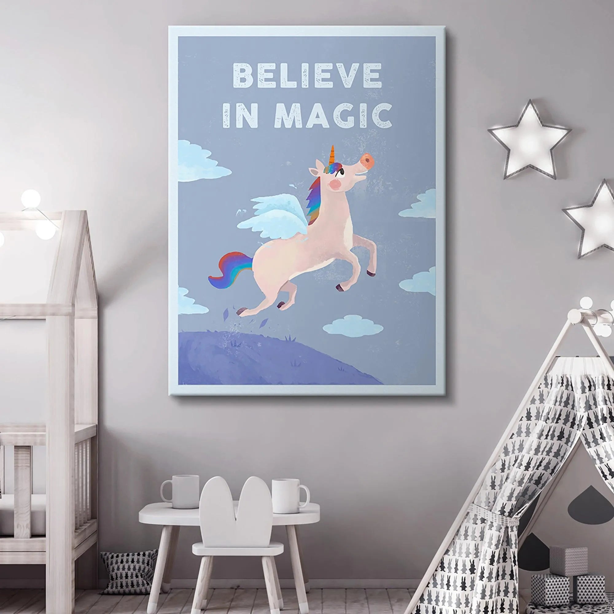 Lifestyle shot of the poster hanging above a crib in a modern children's room where Kids Believe In Magic.