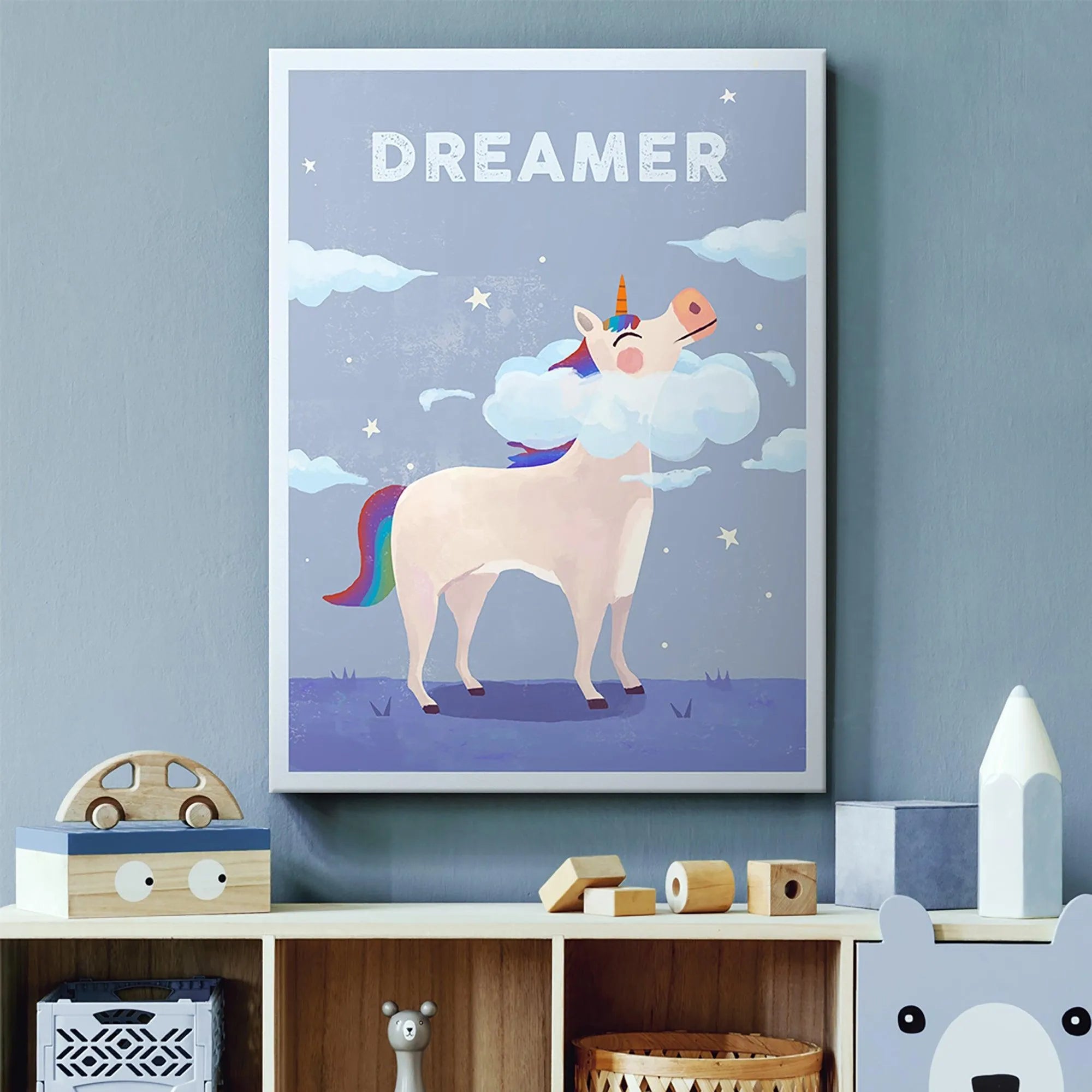 Lifestyle scene of the Kids Dreamer print hung in a modern, brightly lit nursery above a changing table.