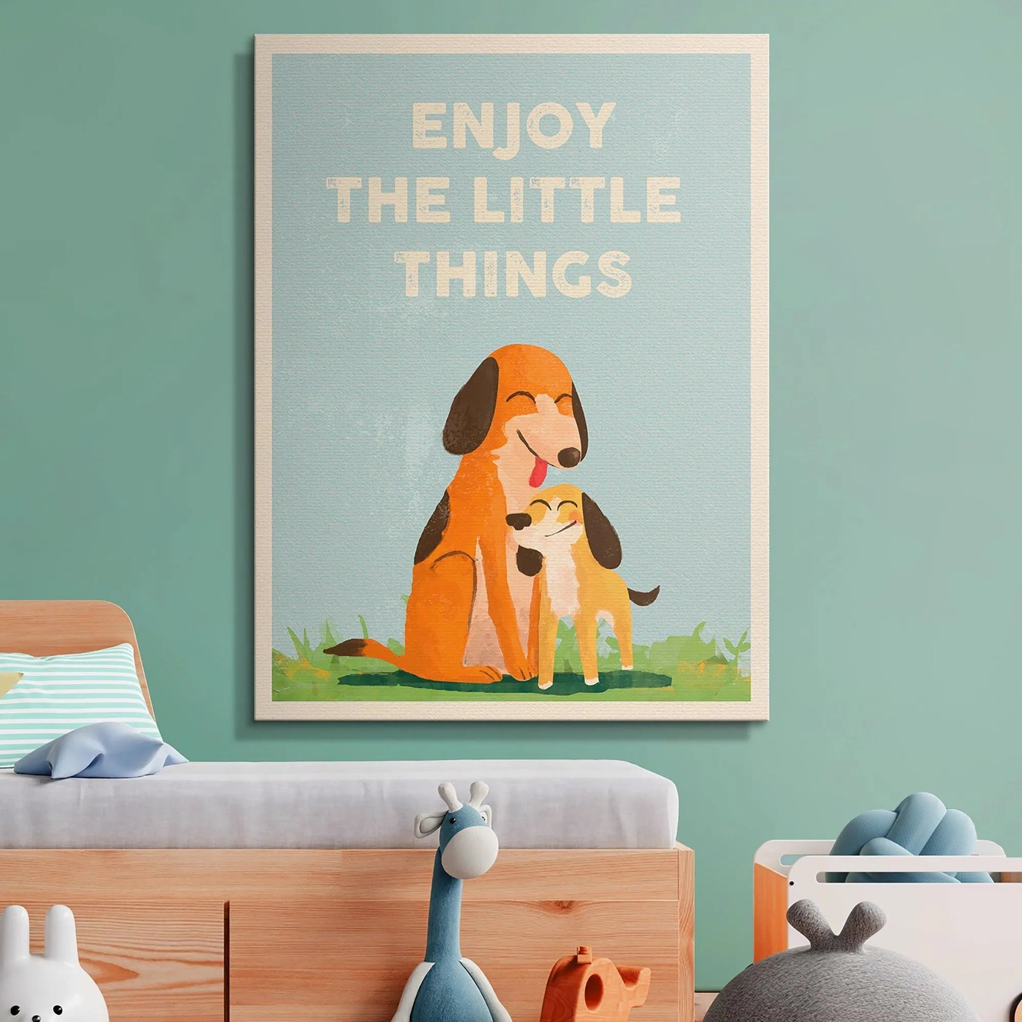 Detail shot of the two cartoon dogs happily sitting on the green grass below the quote 'Kids Enjoy The Little Things'.