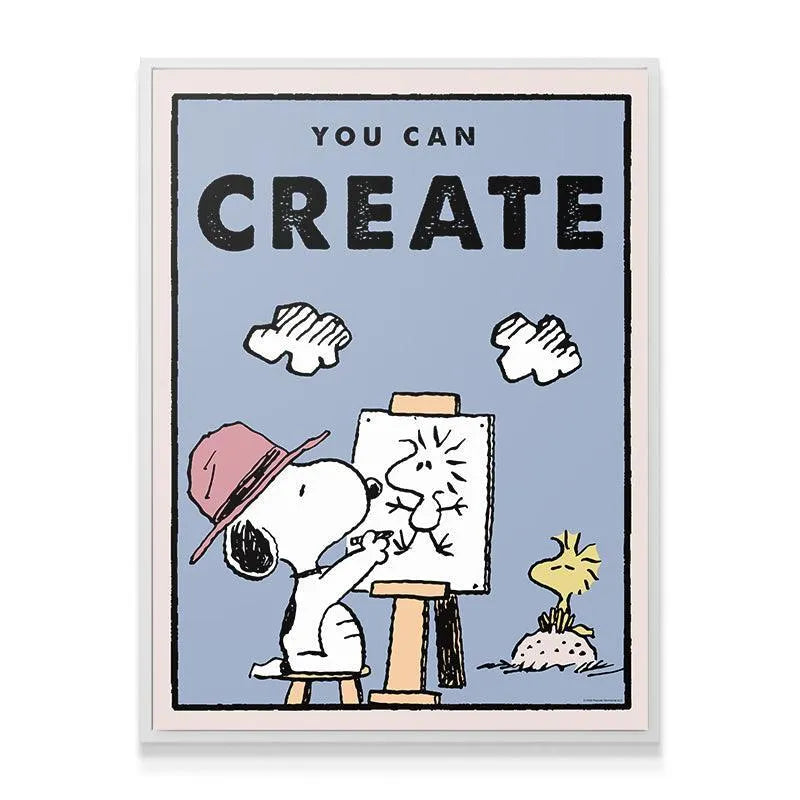Angled view of the framed 'Kids PEANUTS - You Can Create' artwork hanging on a neutral-colored wall.
