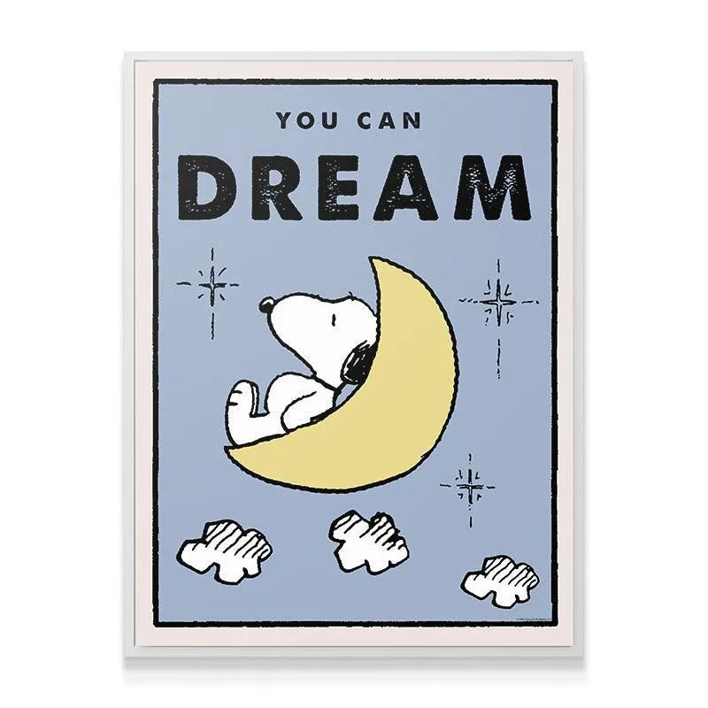 Lifestyle shot of the Kids PEANUTS - You Can Dream wall art framed in a light wood frame in a child's bedroom setup.