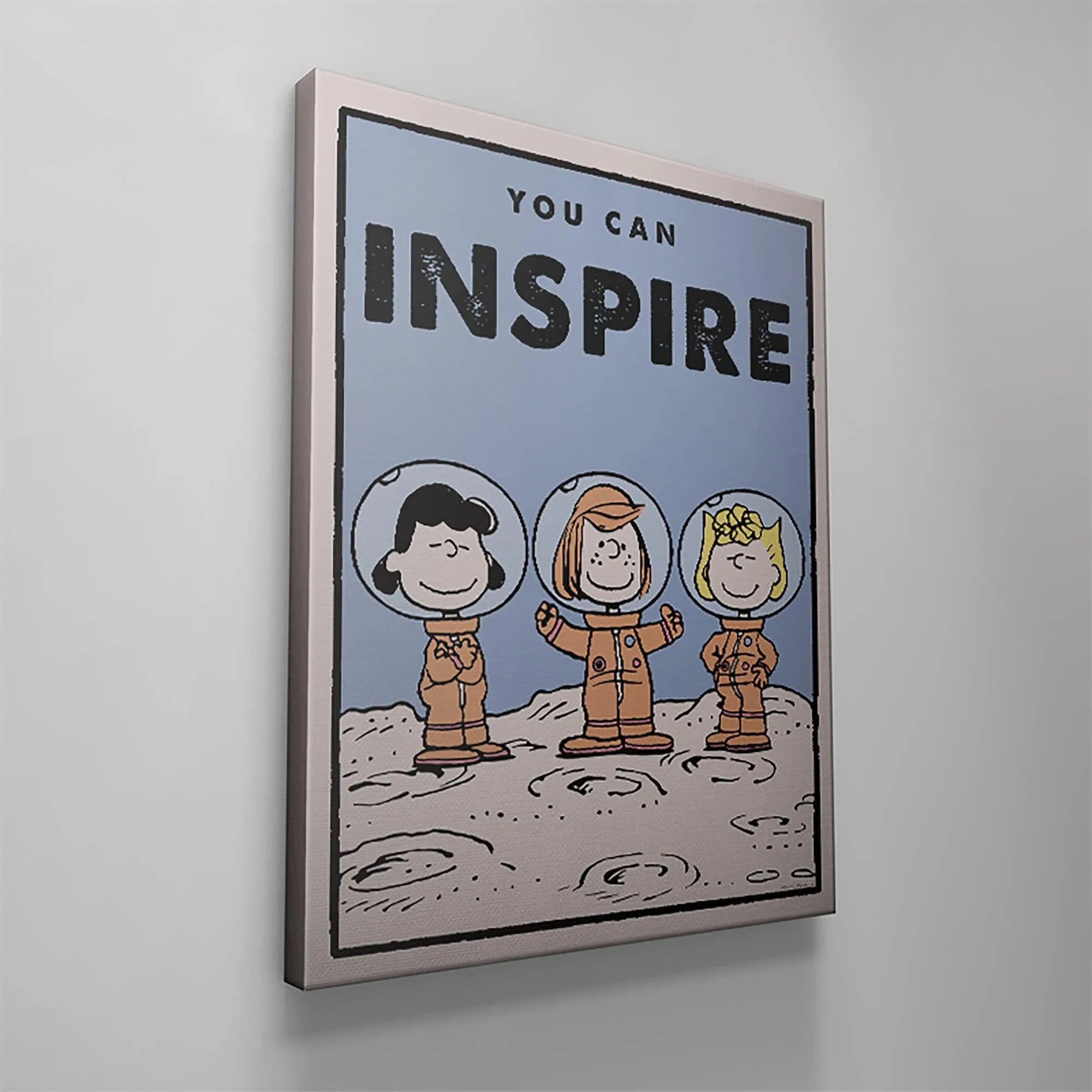 An overhead view capturing the top edge and clean border surrounding the central message of 'Kids PEANUTS - You Can Inspire'.