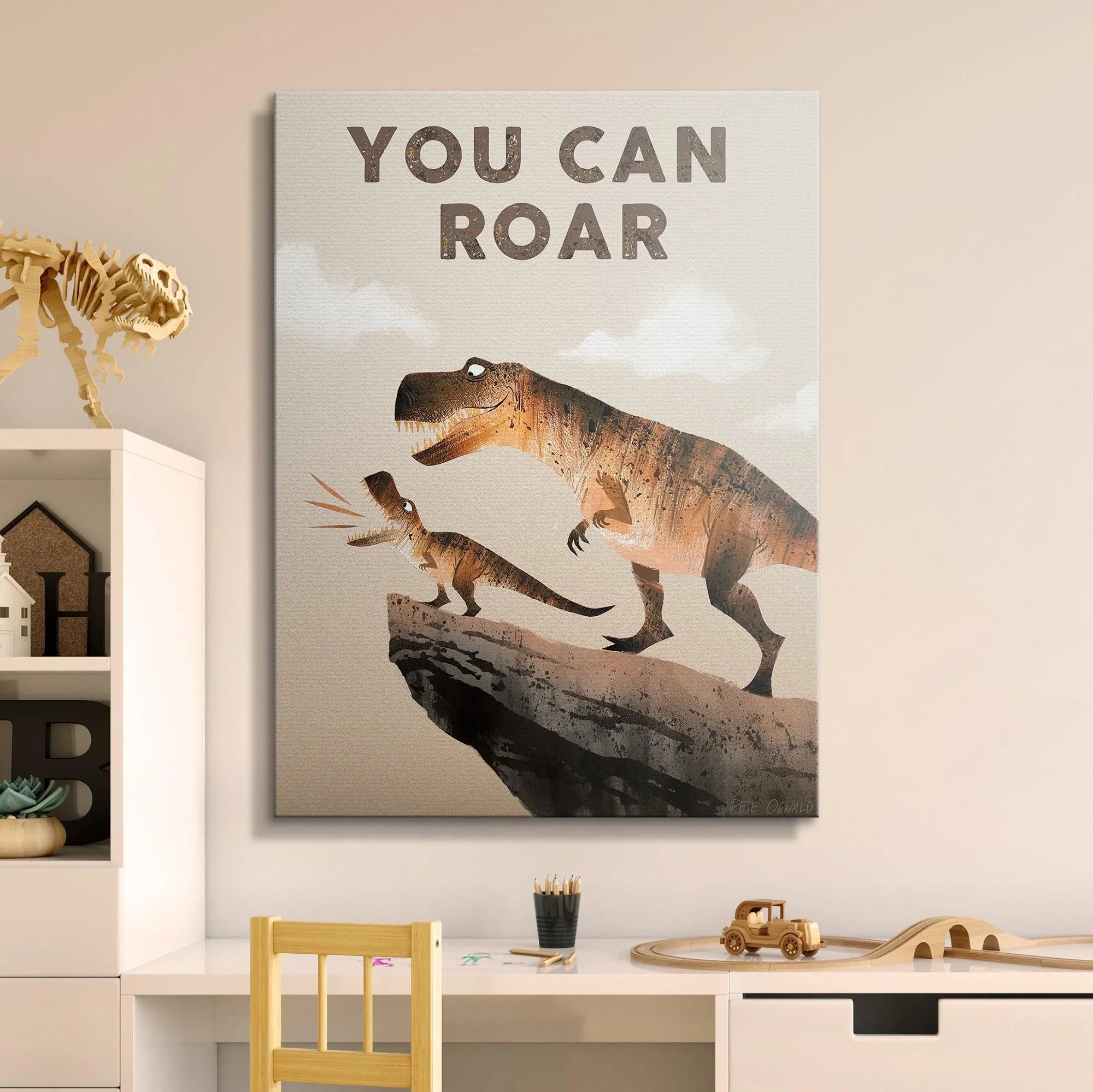 Lifestyle image of the framed 'Kids You Can Roar' poster hanging in a modern, inspirational child's nursery room.