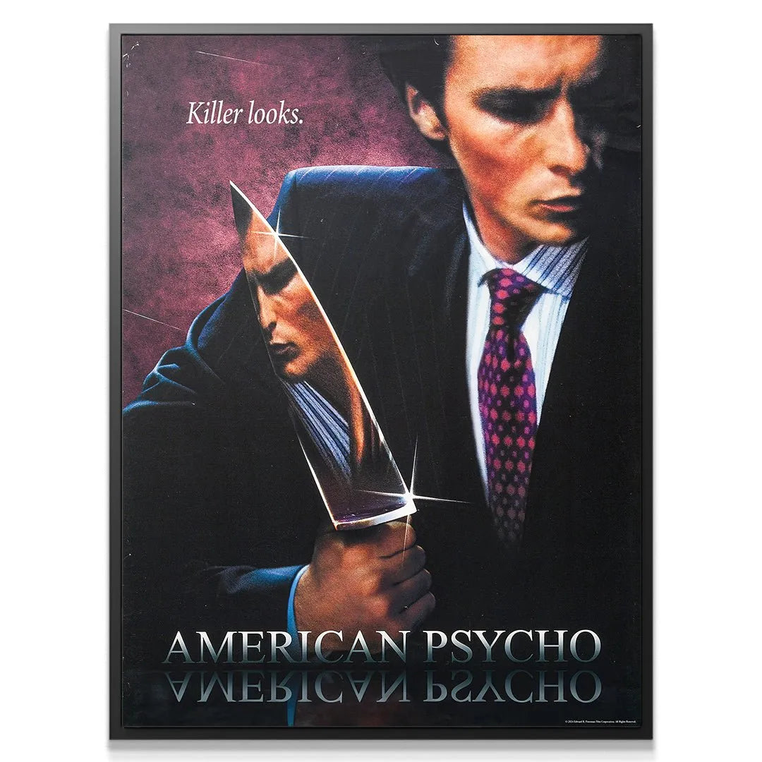Close-up shot of Patrick Bateman's stylish pinstripe suit and distinctive purple tie, embodying the 'Killer Looks' theme.