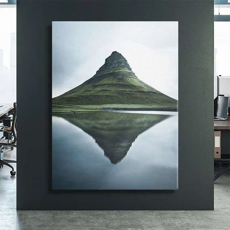 Low angle view emphasizing the conical peak and steep sides of Kirkjufell.