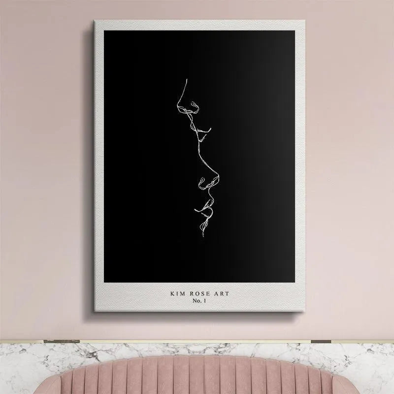 Framed lifestyle shot of the Kiss - Black abstract art displayed centrally in a contemporary living room setting.