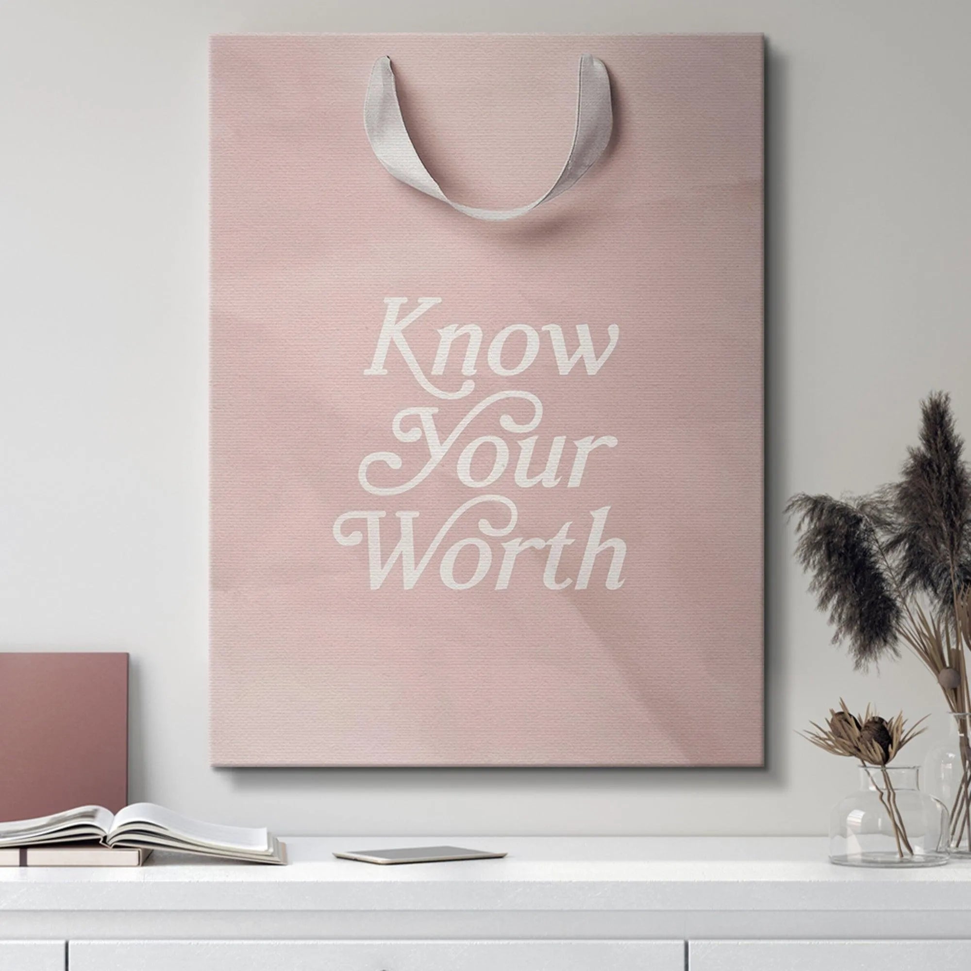 View emphasizing the soft white satin ribbon handles attached to the 'Know Your Worth' gift tote.