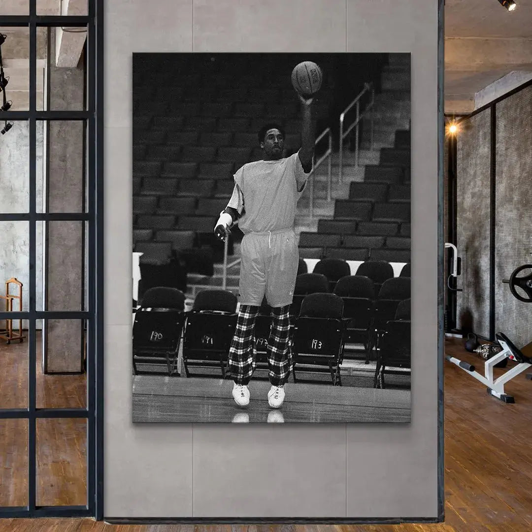 Wide angle of the empty arena bleachers serving as the solemn backdrop for Kobe Bryant - By Any Means practicing alone.