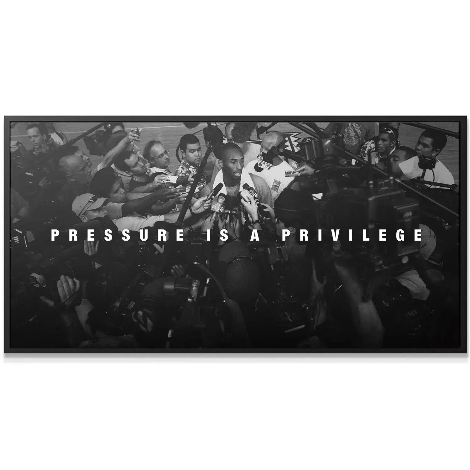 Detailed close-up showing the intensity in Kobe Bryant's face during the "Pressure Is A Privilege" media scrum.