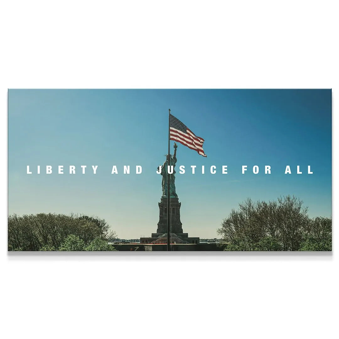 Panoramic view of Lady Liberty - Liberty & Justice For All, emphasizing the wide blue sky background and clear horizon.