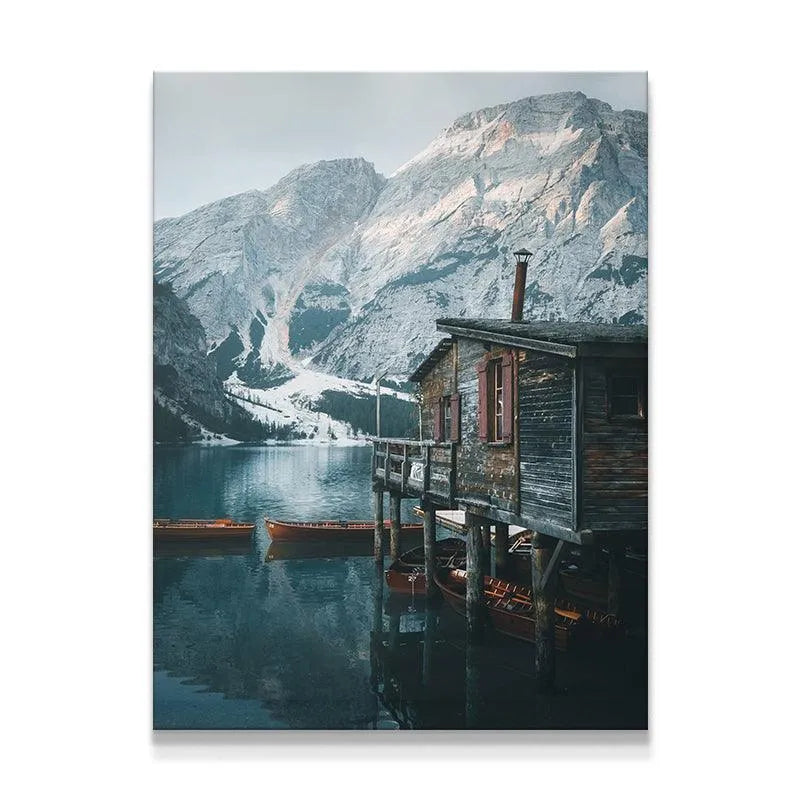 Full vertical view of the boathouse at Lago Di Braies reflecting on the calm water.