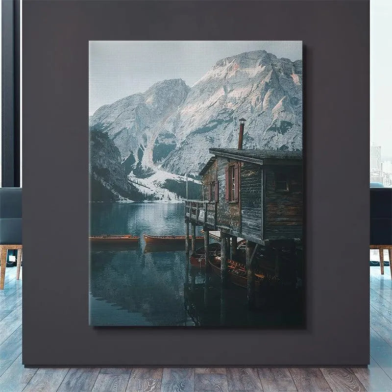 Atmospheric lighting illuminating the rustic architecture of the boathouse at Lago Di Braies.