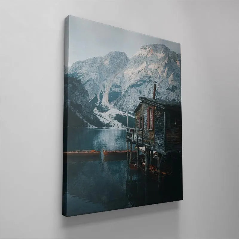 Angle showcasing the stilts and submerged portion of the Lago Di Braies building foundation.