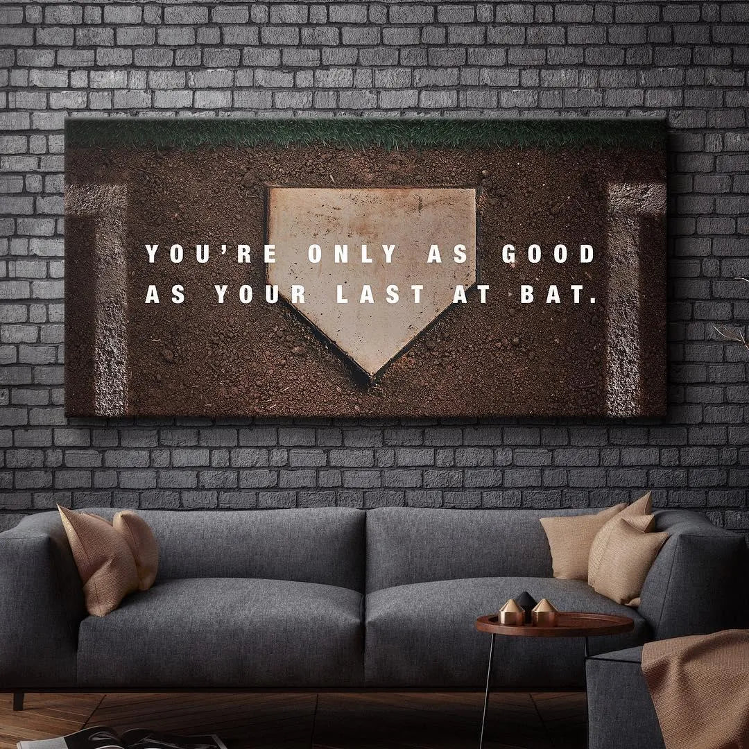 Detail of the quote typography, 'You're only as good as your Last At Bat,' against the faded baseball base.