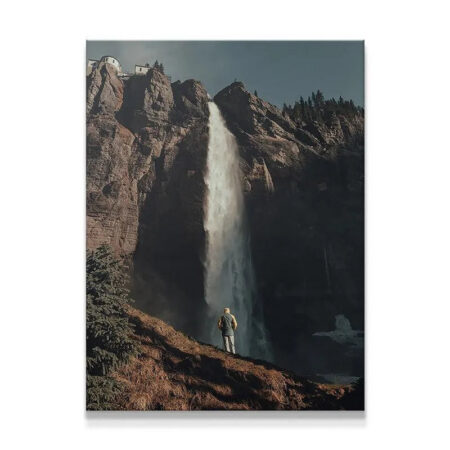 Vertical view of the majestic Last Light Falls plunging over dark mountain cliffs.