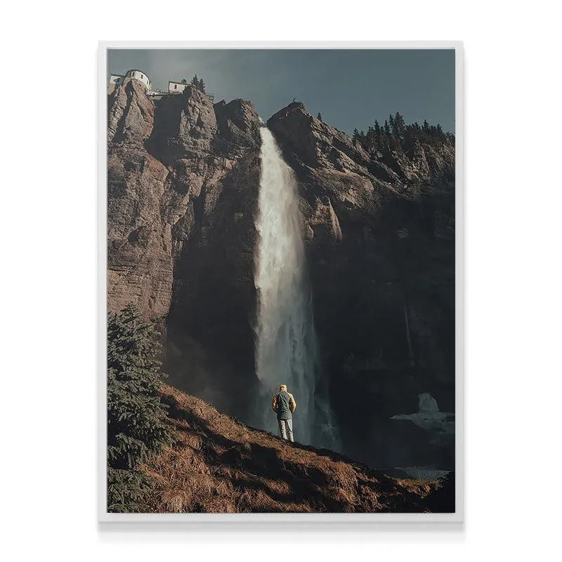 Wide-angle shot showing the lone hiker observing the immense Last Light Falls.