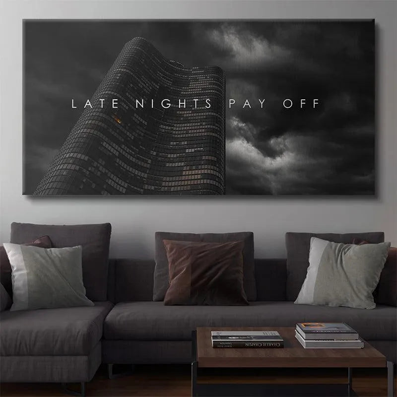 Vertical composition illustrating the dramatic curvature of the building and the text overlay 'Late Nights Pay Off' prominently displayed.