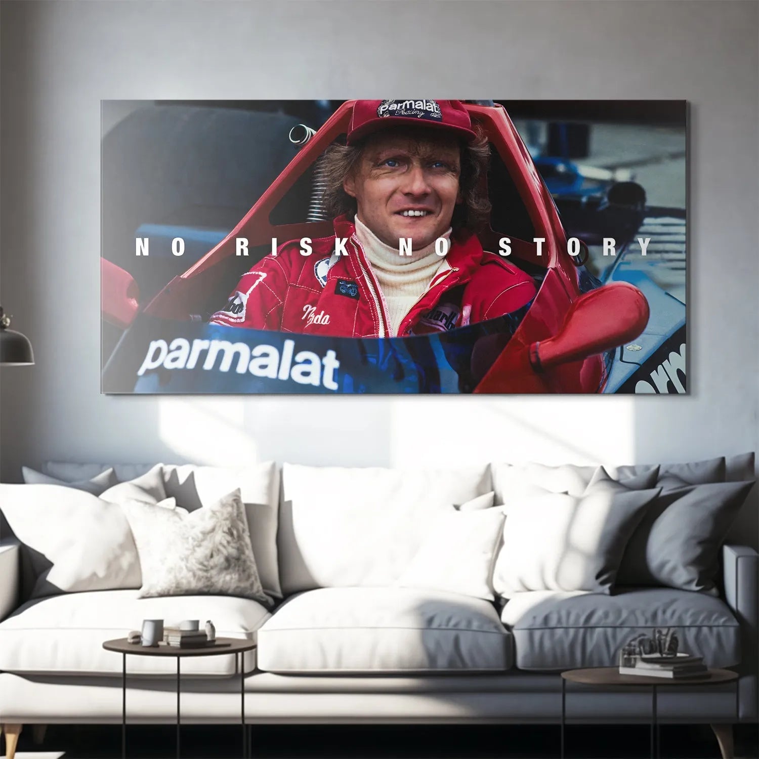 Textured detail of Niki Lauda's red racing suit and the intense gaze, emphasizing the message: Lauda - No Risk No Story.