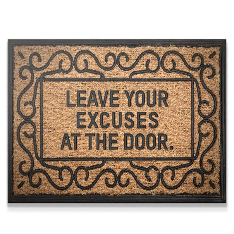 Overhead view of the natural coir fiber texture on the "Leave Your Excuses At The Door" welcome mat.