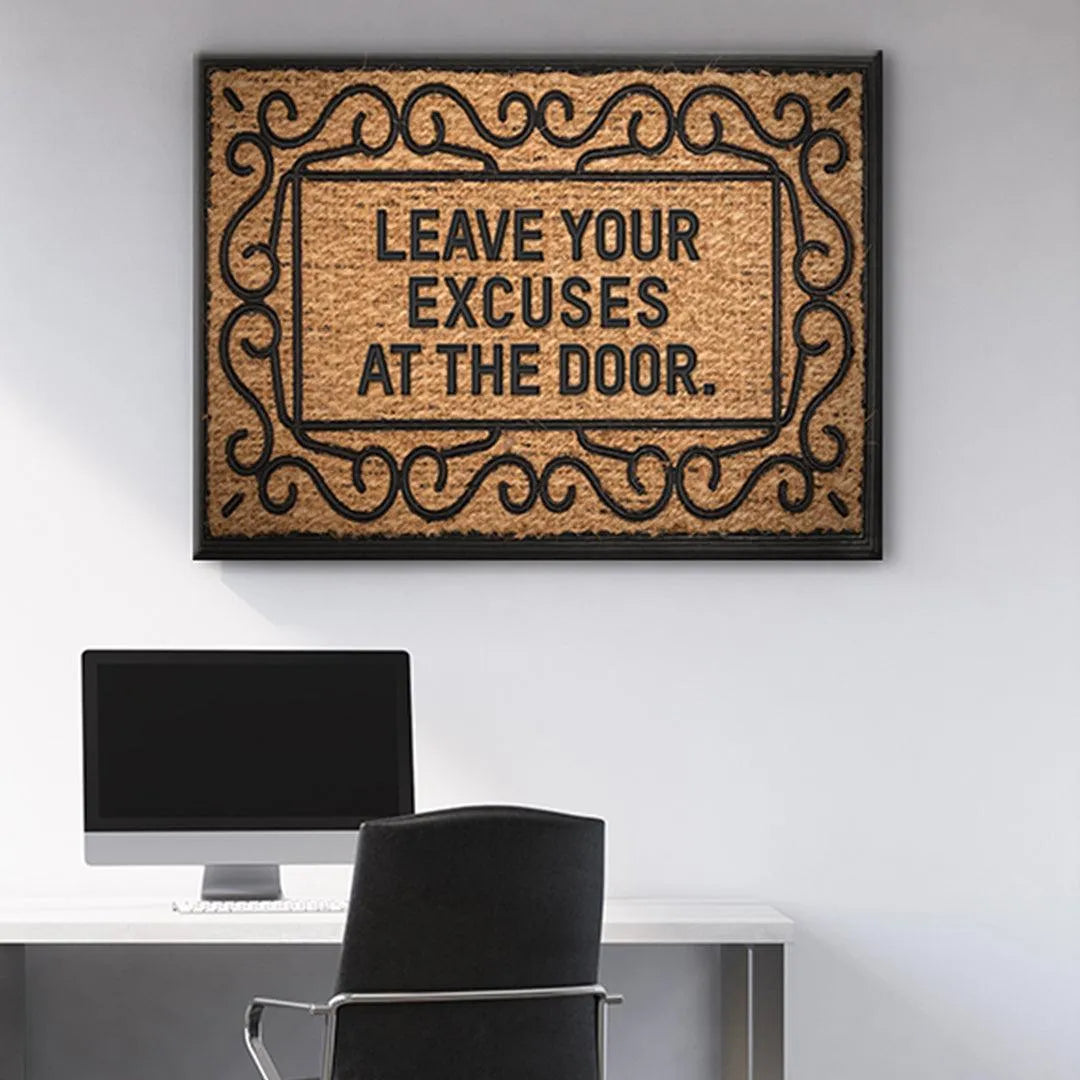 Lifestyle image showing the "Leave Your Excuses At The Door" mat placed outside a modern entryway.