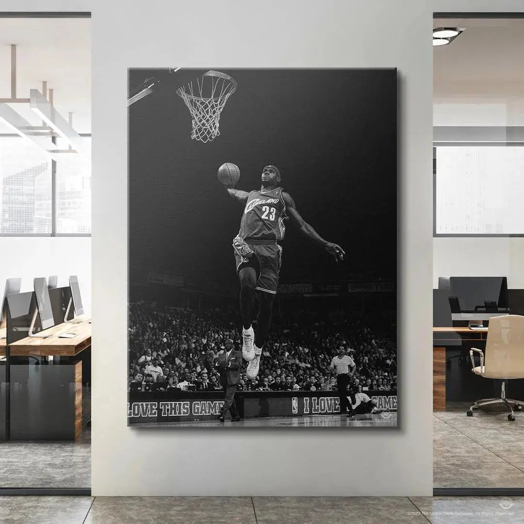 Black and white print showing the intensity of LeBron's face while executing the dunk in LeBron James - Kingdom Come.
