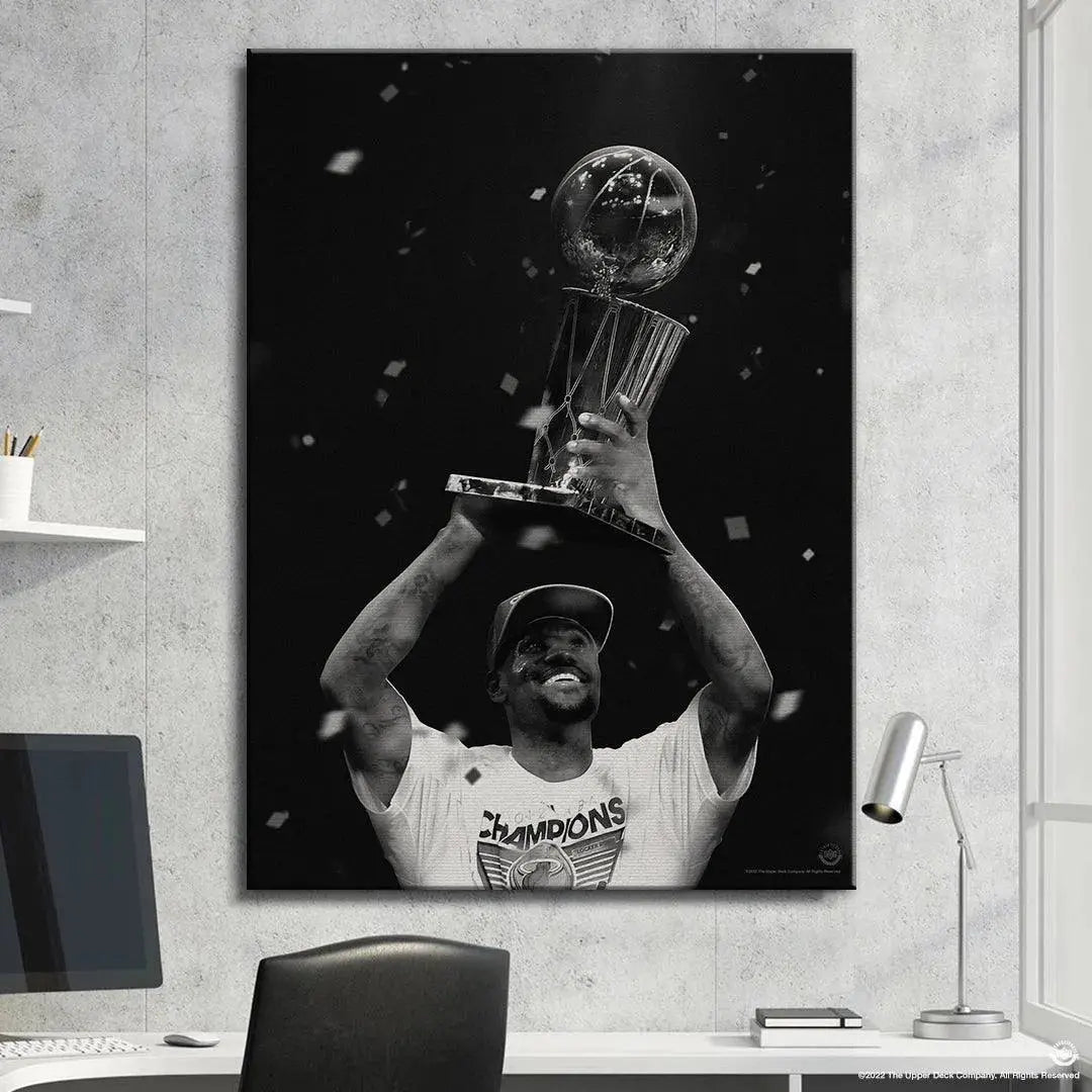 Black and white atmospheric shot of LeBron James - The First surrounded by falling celebration confetti.