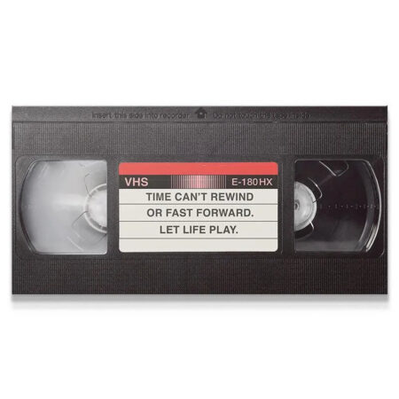 Full isolated view of the black VHS tape graphic emphasizing the message to 'Let It Play'.
