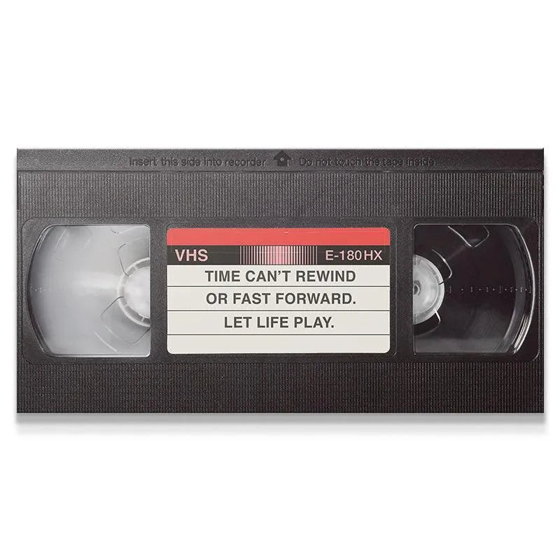 Full isolated view of the black VHS tape graphic emphasizing the message to 'Let It Play'.