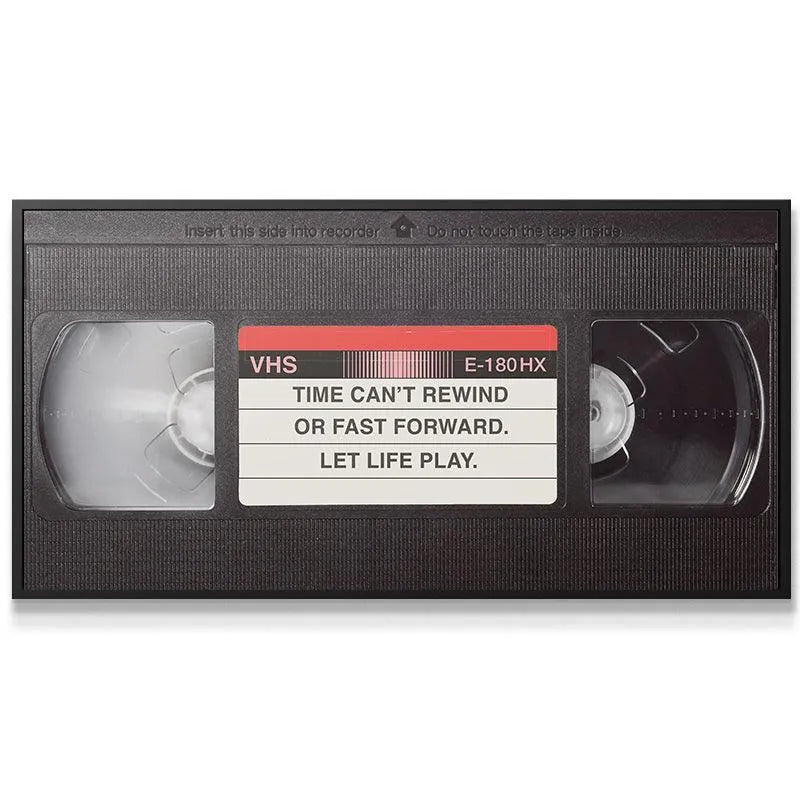 Close-up texture shot revealing the plastic casing and subtle grain of the 'Let It Play' cassette art.