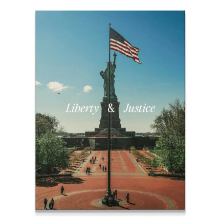 Full view of Statue of Liberty and American flag against blue sky, titled 'Liberty & Justice 2'.