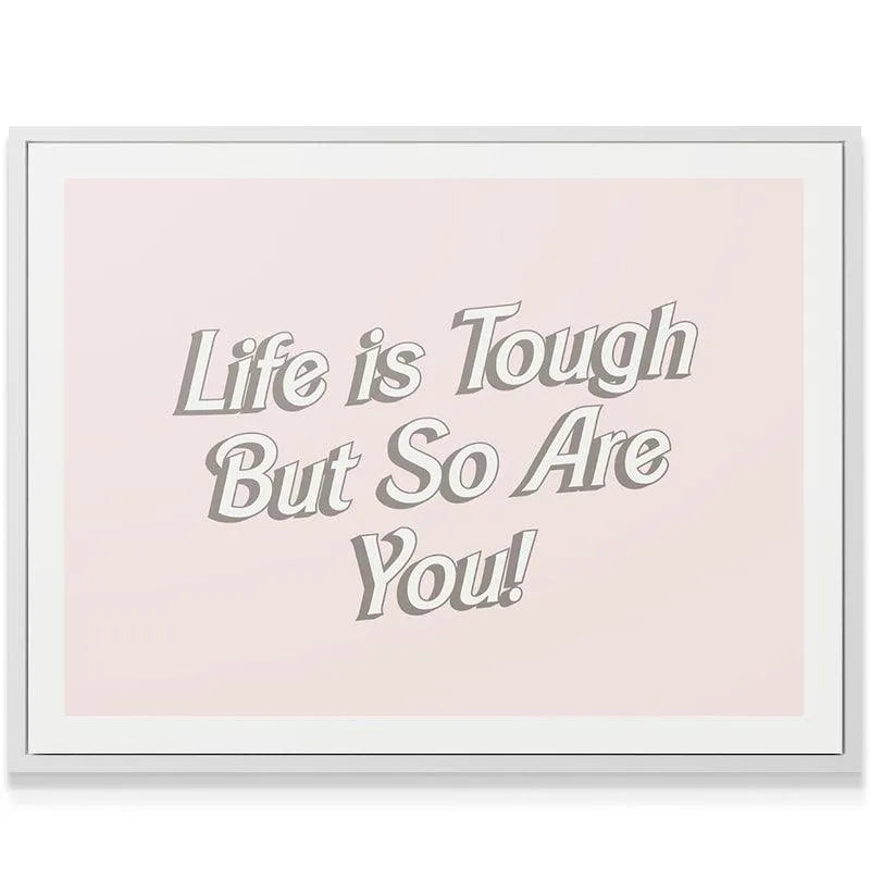 Overhead angle of the motivational poster confirming that Life is Tough but strength prevails.