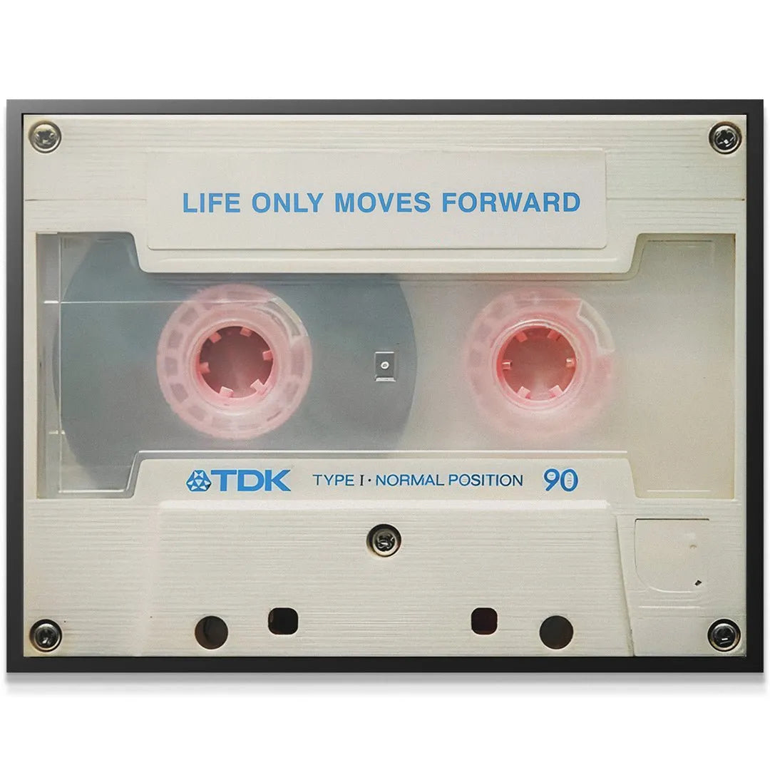 Detailed close-up showing the pink spools and clear plastic window of the art print, emphasizing 'Life Only Moves Forward'.