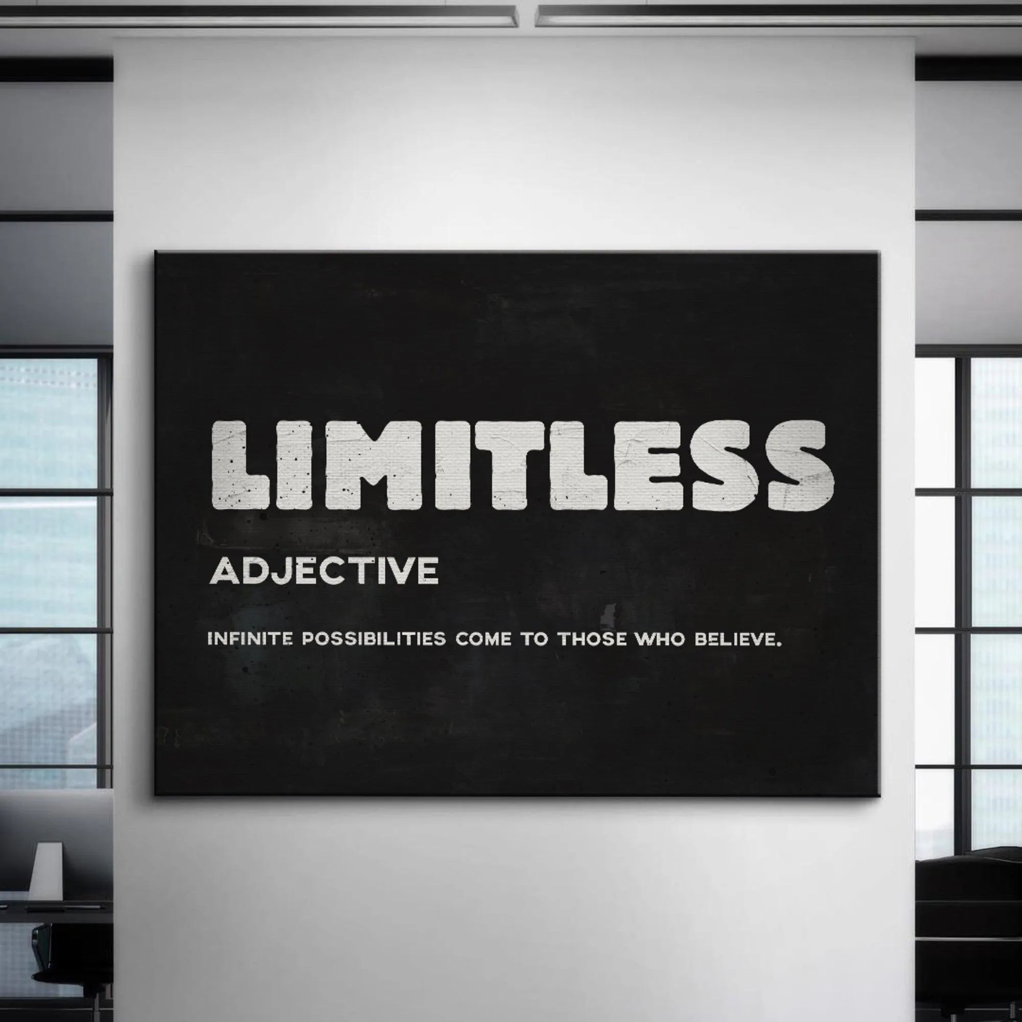 Detail focusing on the grain and texture of the black background surrounding the bold white word Limitless.