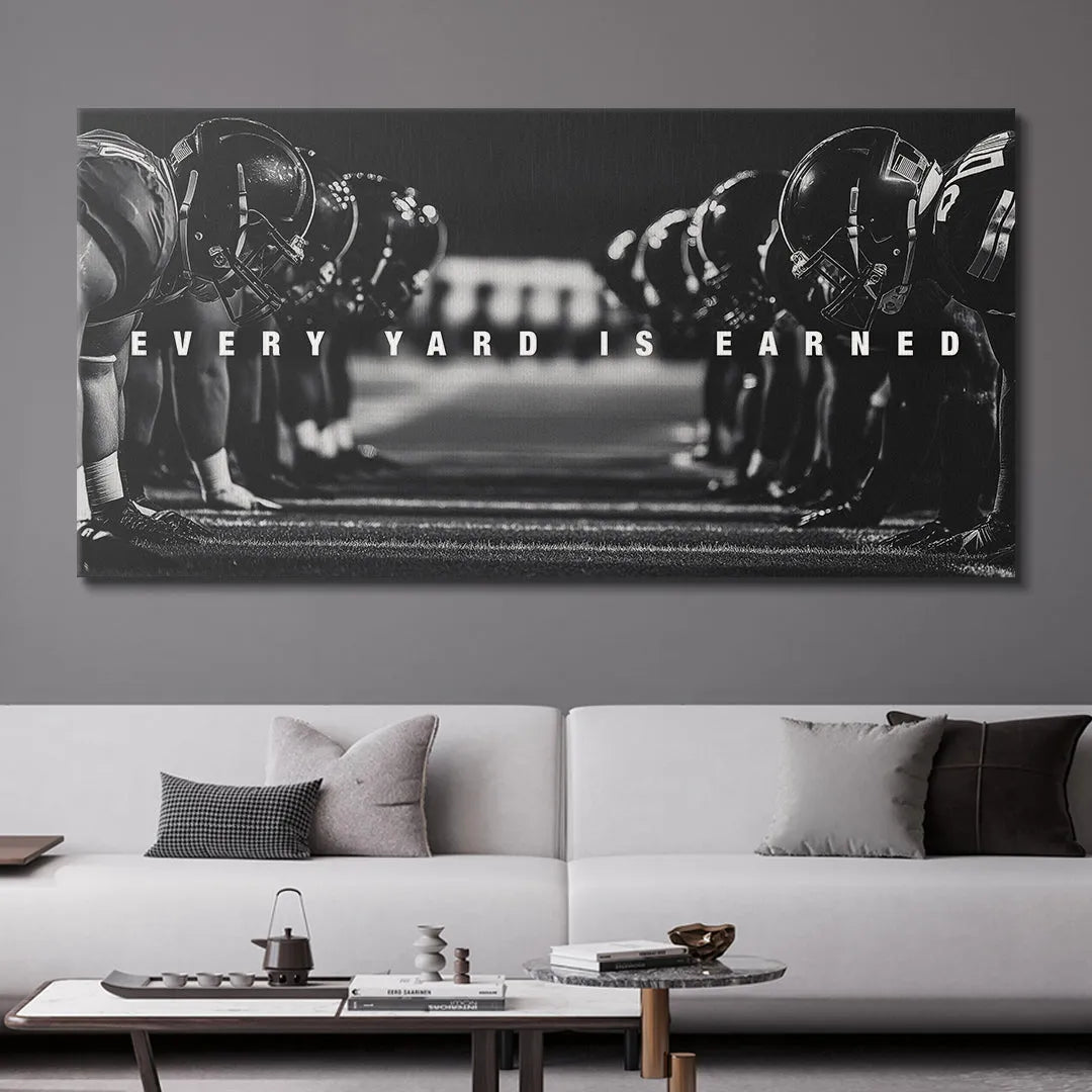 Wide view of the football field showing the dramatic contrast and text overlay: 'Linemen - Every Yard Is Earned'.