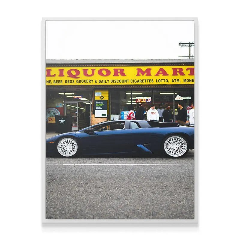 Street level view showcasing the low-riding stance of the Lamborghini featured in Liquor Mart Murcielago artwork.