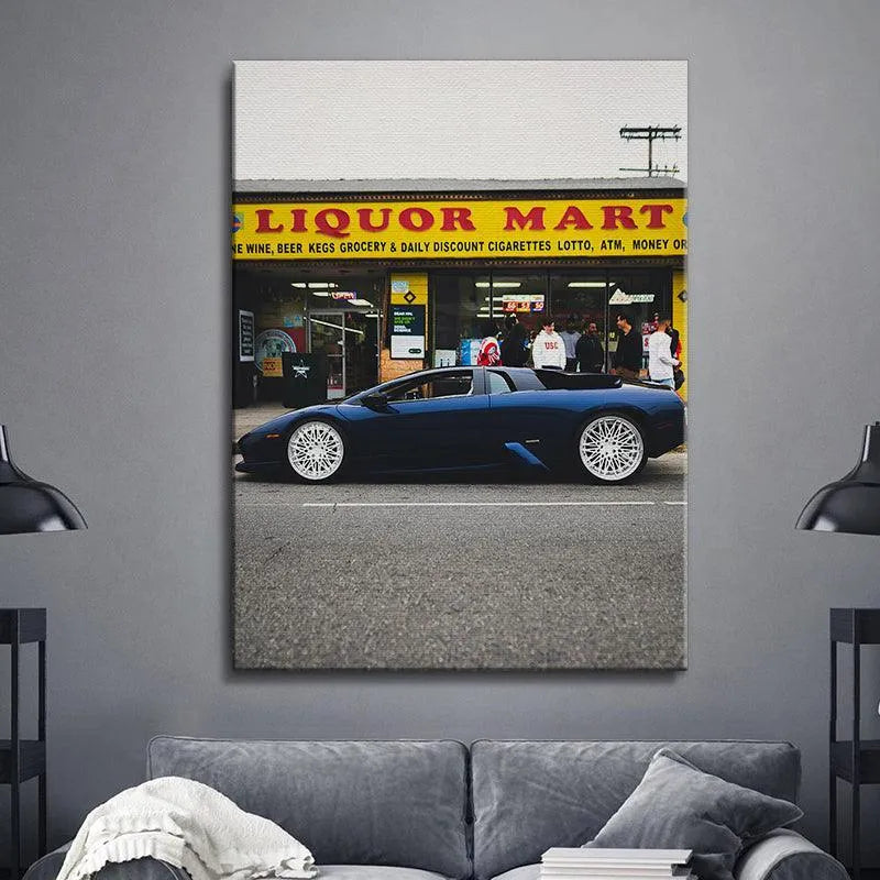 Artistic photograph capturing the contrast between the rough asphalt and the glossy finish of the supercar: Liquor Mart Murcielago.