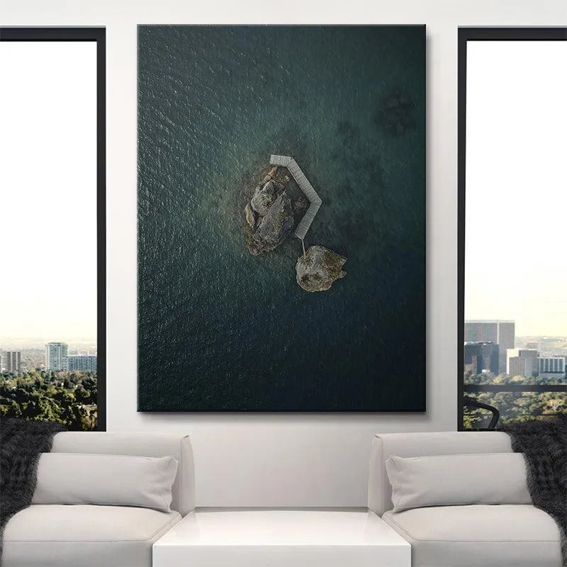 Lifestyle shot featuring the large framed 'Lonely Rock' artwork hanging in a minimalist living room.